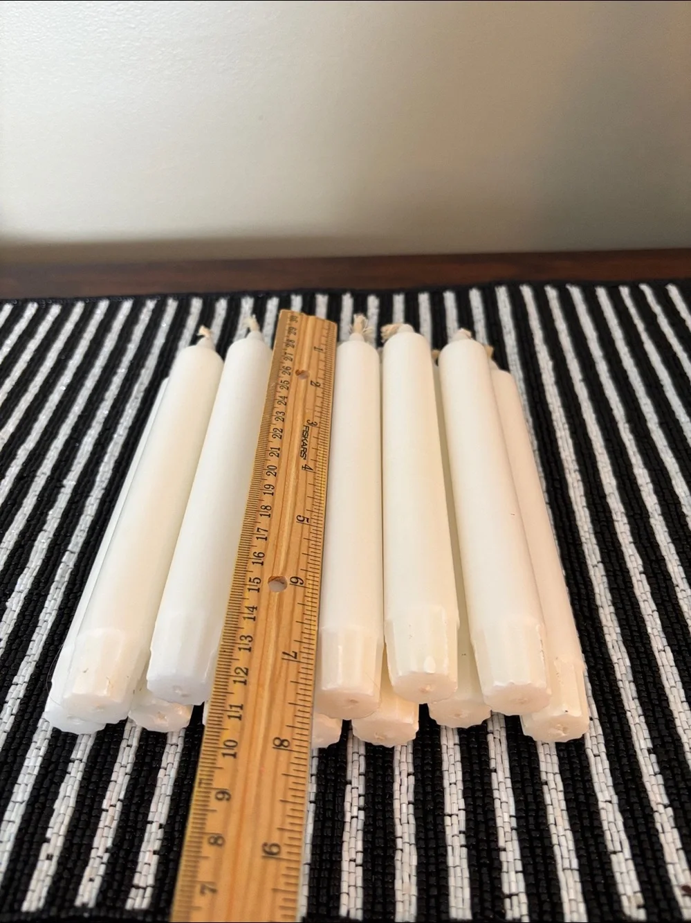 Bundle of 12 white taper candles with ribbed self-fitting ends